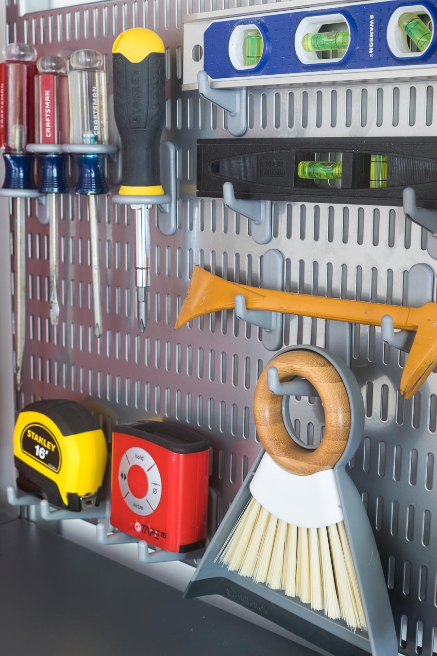 The smartest was to organize your most-used tools! She used Elfa utility boards with different types of board hooks to hold screwdrivers, levels, and more!