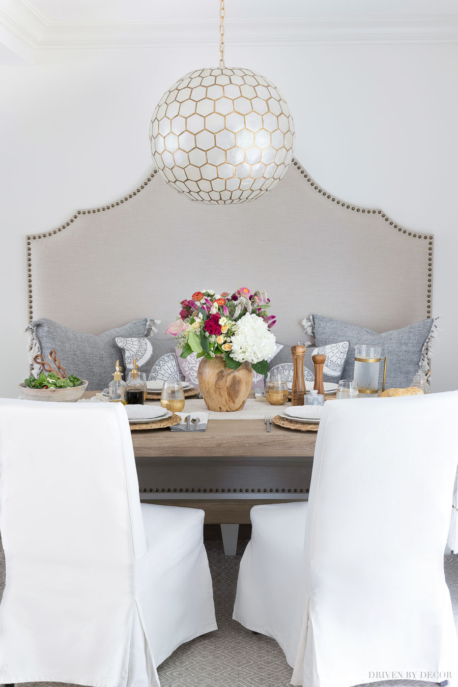 Super inexpensive white slipcovered dining chairs! Source linked in post!