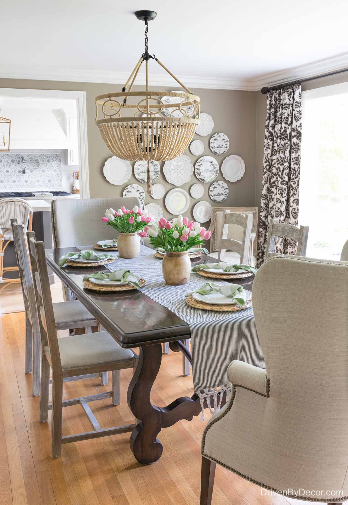 Dining room with large plate wall - shows how high to hang a grouping of pictures or plates on the wall