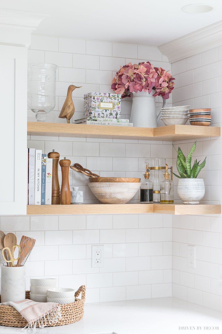 Faux hydrangeas that look real! Love them in a pitcher on this open kitchen shelving!