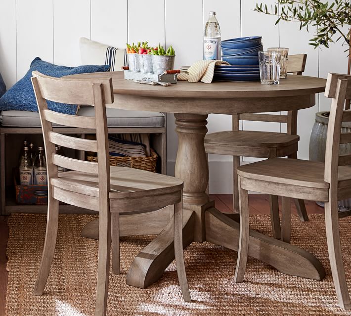 A ladderback wood dining chair in a beautiful weathered gray finish