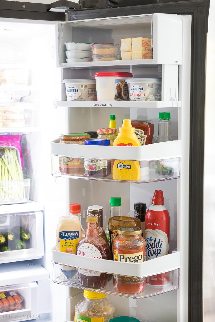 Love that there's a drop down tray on the inside of the refrigerator door that I can close when space is needed for taller items below!