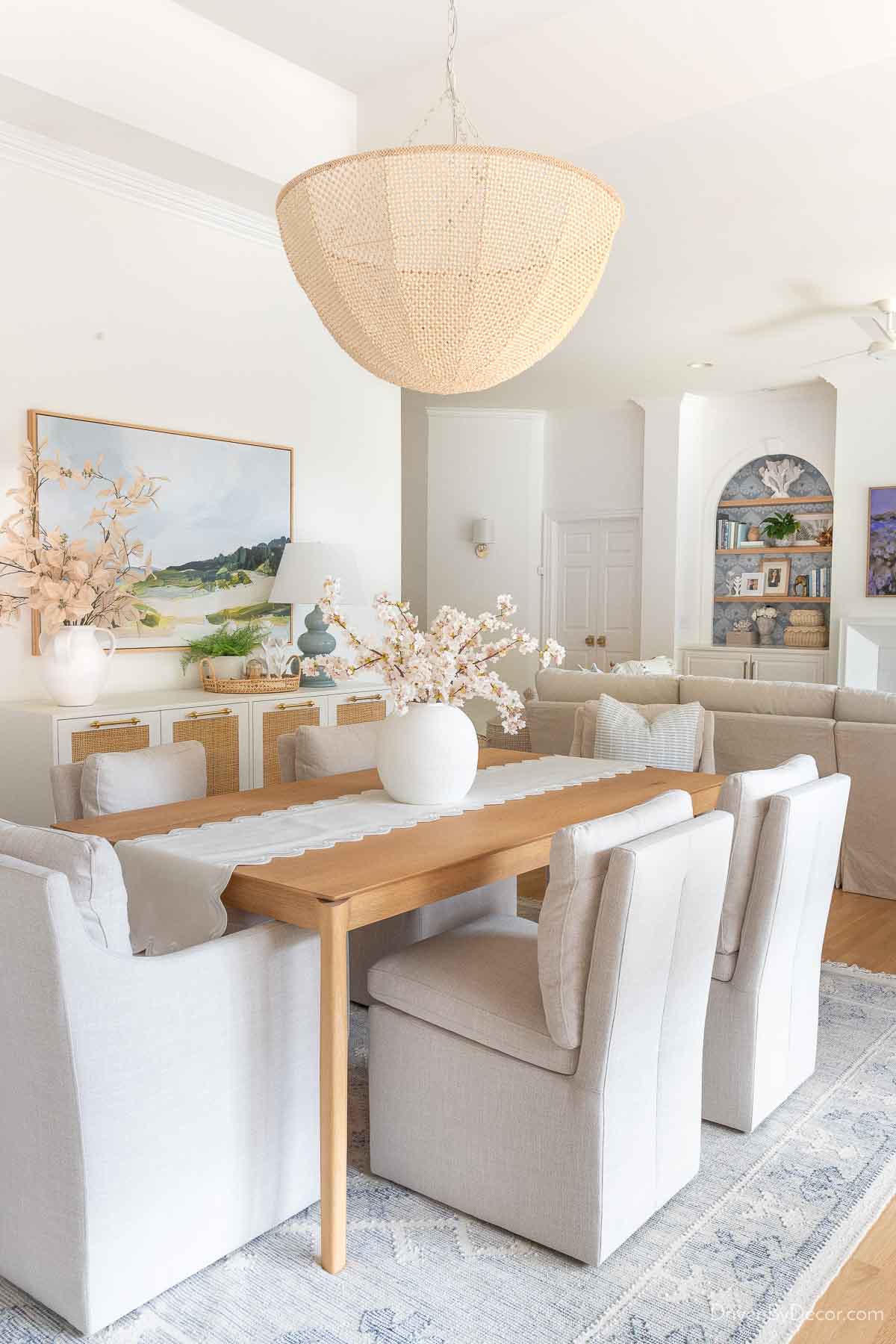 Beaded chandelier hung over dining room table