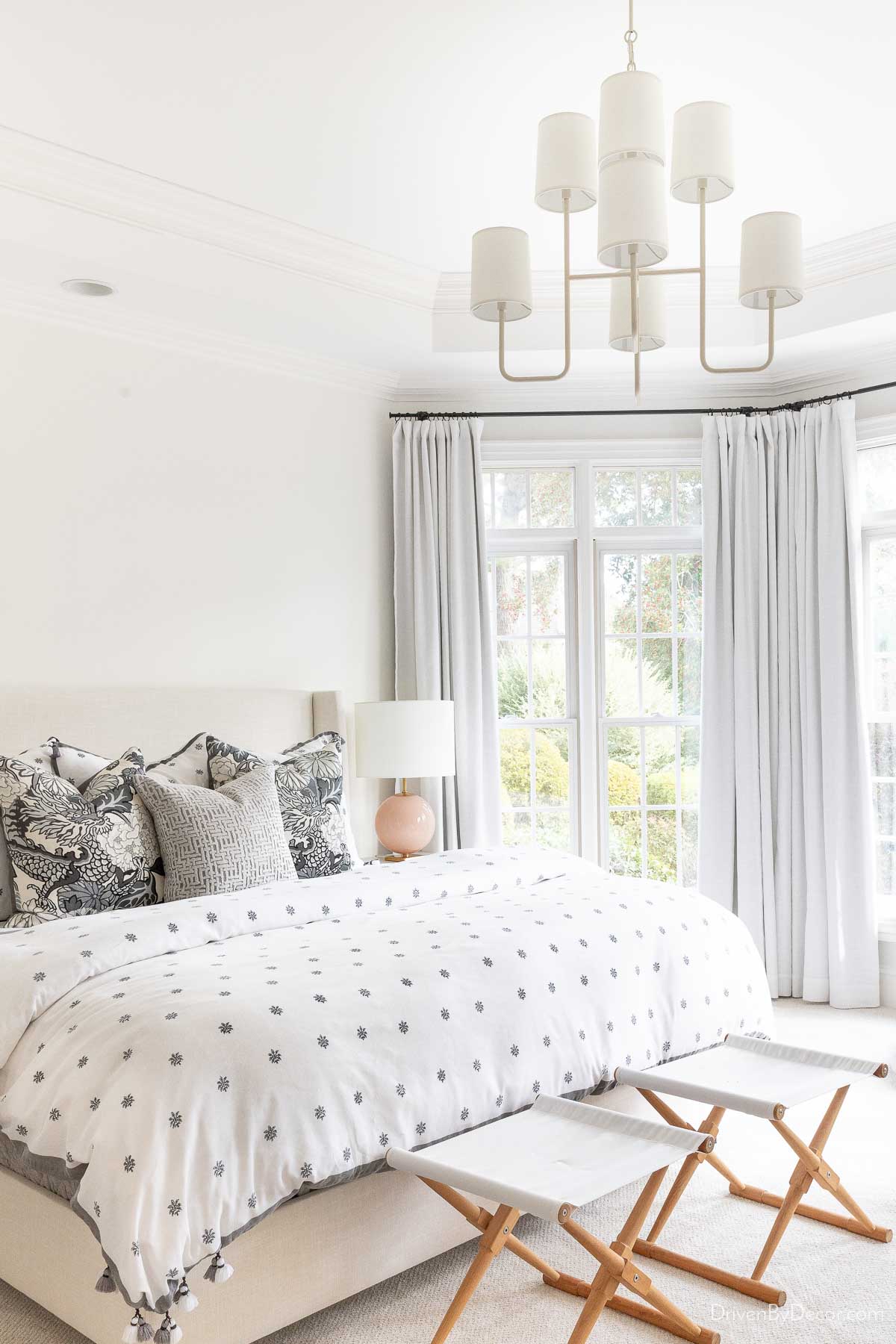 Bedroom with tiered chandelier with shades