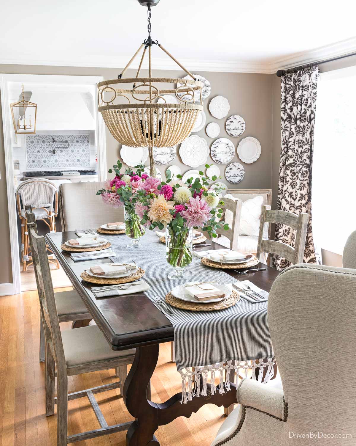 Wood bead chandelier over dining room table