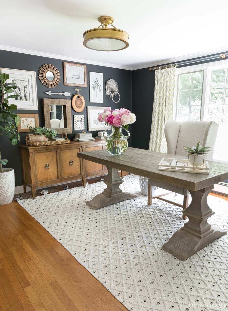 Love the gold semi-flush mount light fixture in this home office!