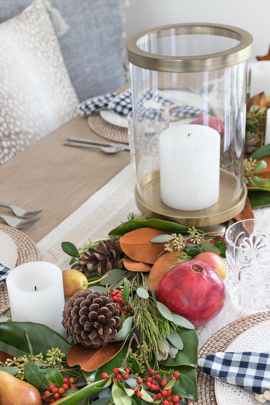 Gorgeous brass hurricane used as part of this greenery table runner - more details in the post!