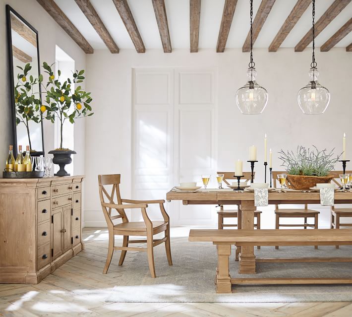 Loving the look of wood beams added to the ceiling of this dining room!