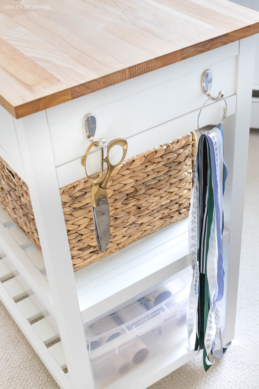 Such a clever use of this cart for a gift wrapping station! Love how the hooks are used for scissors and extra ribbon pieces. 