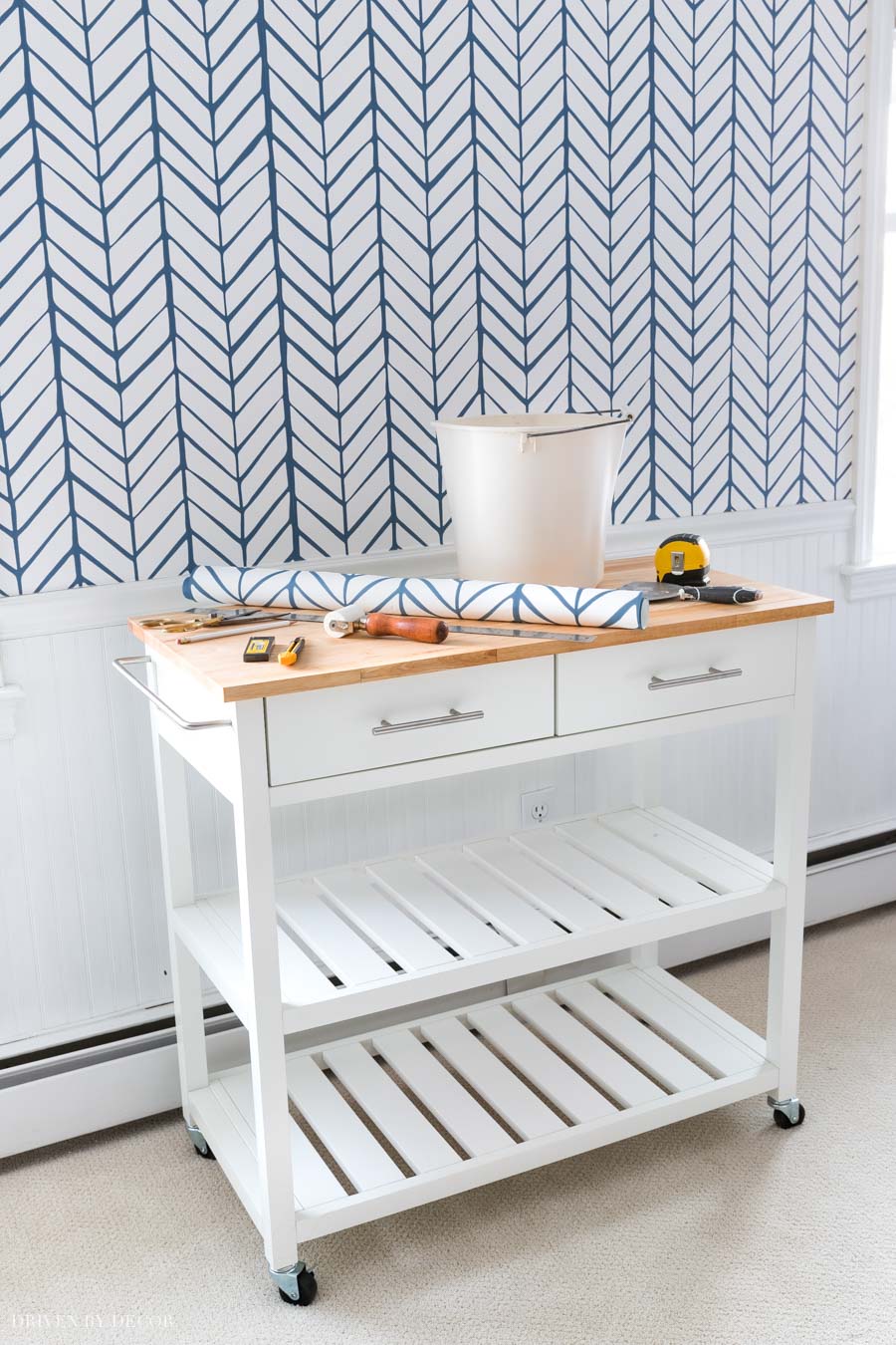 This rolling kitchen cart is so helpful for holding supplies while wallpapering or painting!