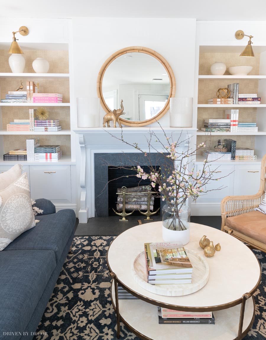 Stunning blue and white family room with fireplace and built-in bookcases. All sources are linked in the post!