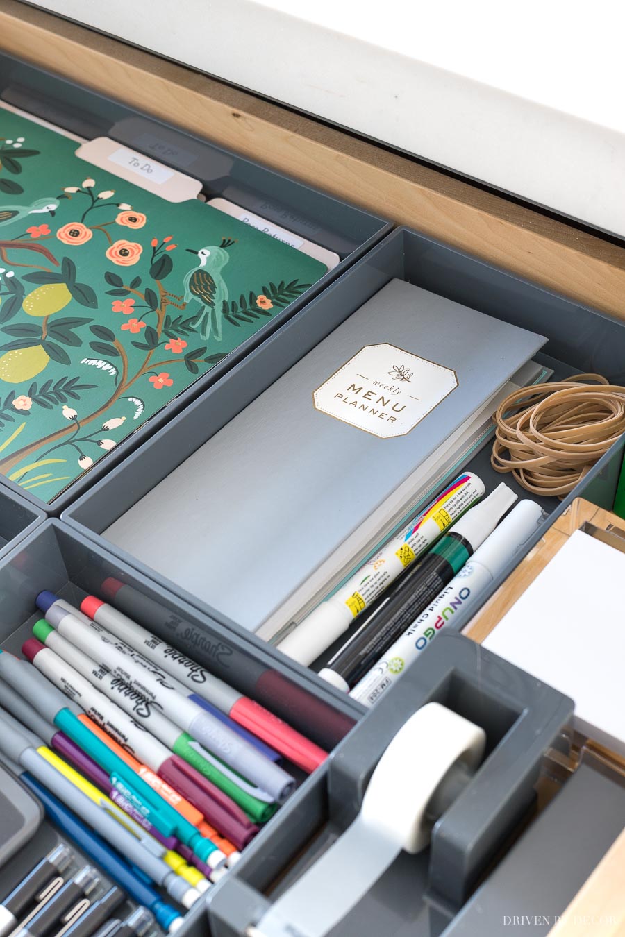 These gray trays are awesome for organizing drawers like the one in this kitchen command center!