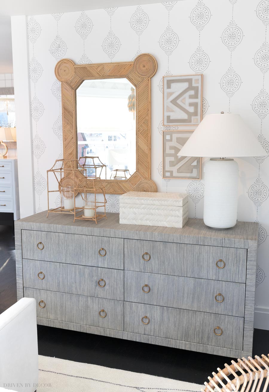 Adding texture to a space does so much for warming it up! Love this raffia console and rattan mirror!