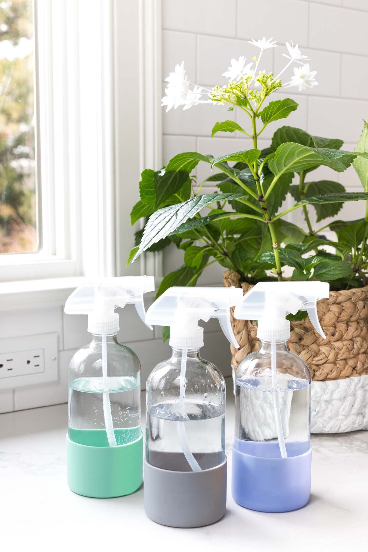 Glass spray bottles with silicone sleeves