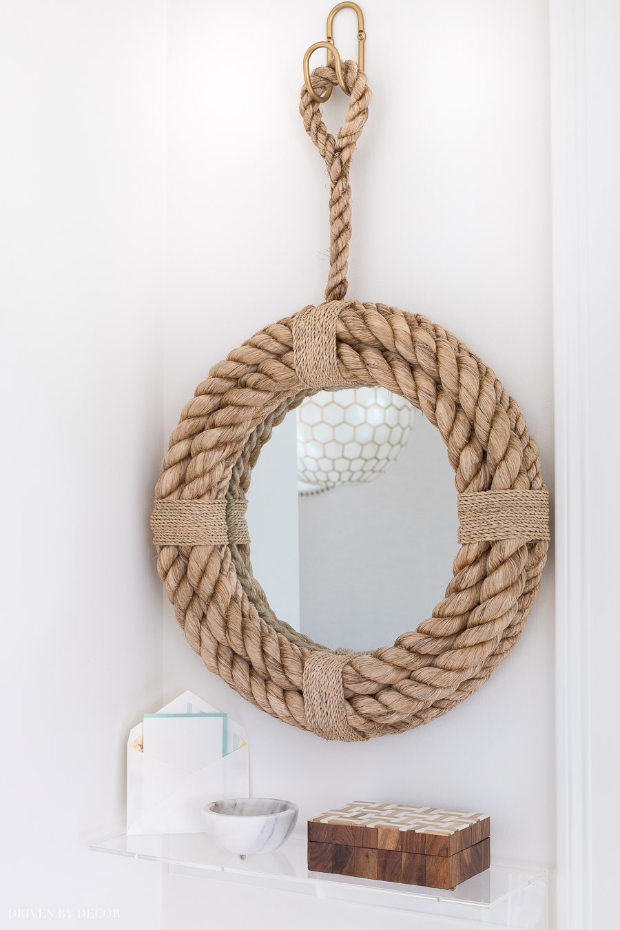 A rope mirror and small acrylic shelf - super cute decor for a small entryway