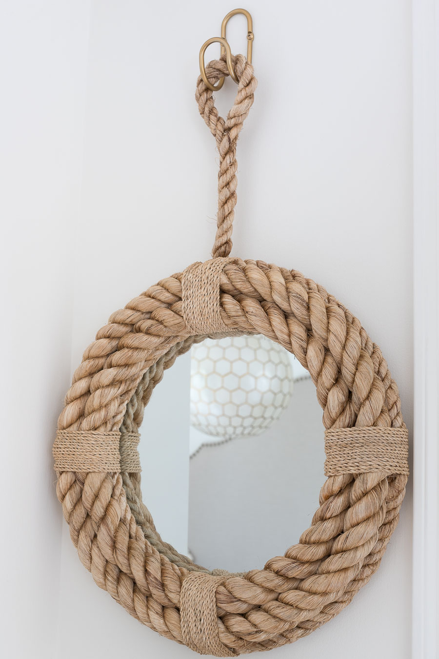 Darling round rope mirror that's perfect for a small entryway like this one going out to the garage!