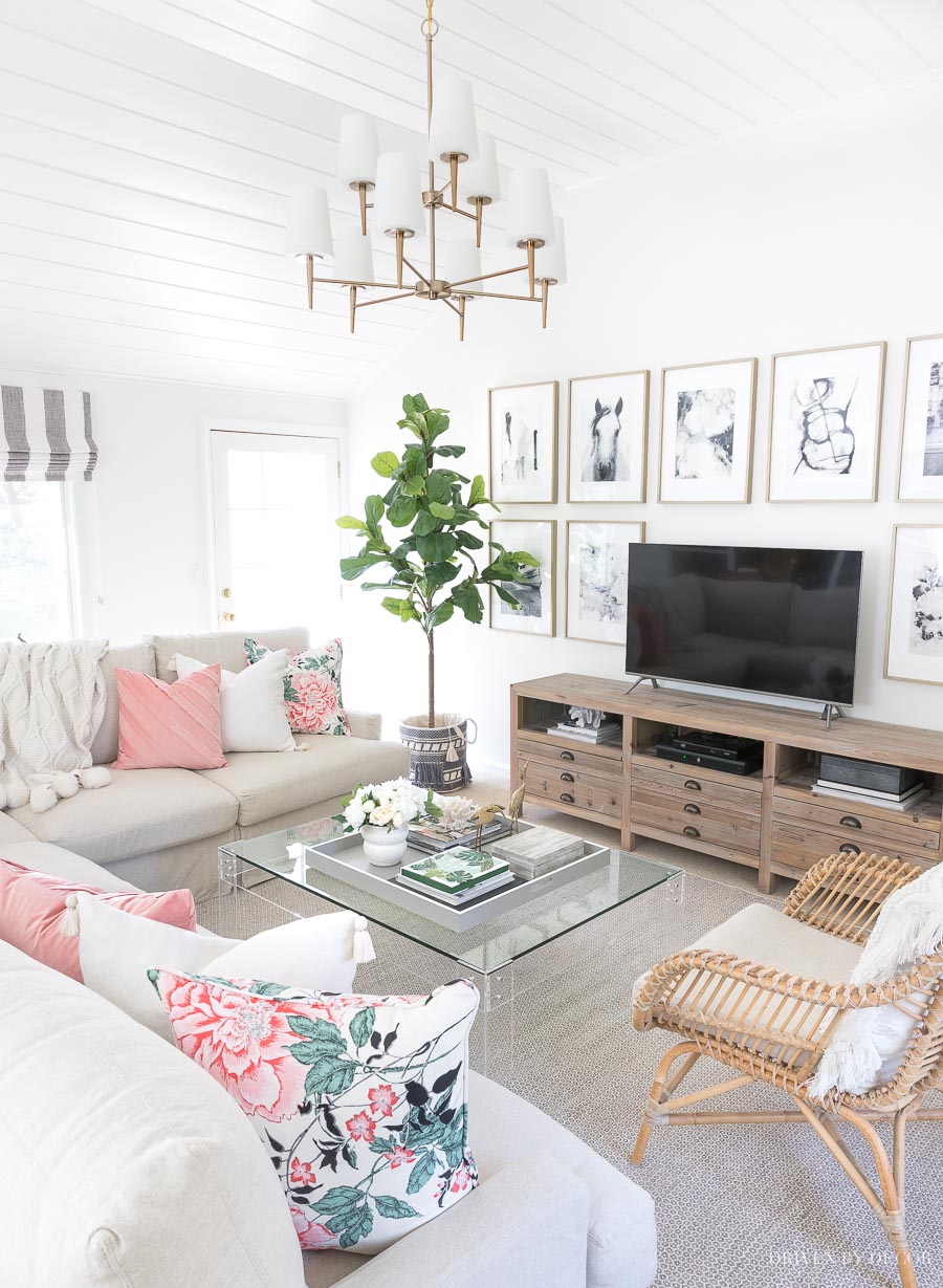 Our spring family room! Loving the floral pillows and tasseled basket from the Flower Home collection!