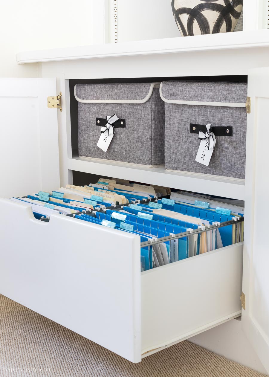 Loving this hidden cabinet drawer for hanging file folders! Great organization!
