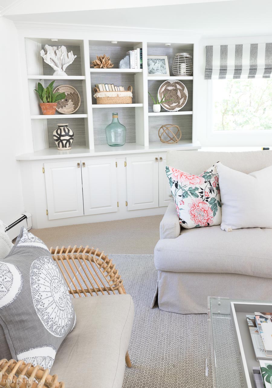 A combination of closed cabinets at the base and open bookshelves up top is perfect for family room storage!