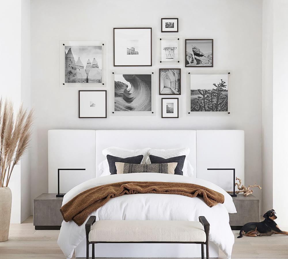 Gallery wall layout of photos as above bed decor