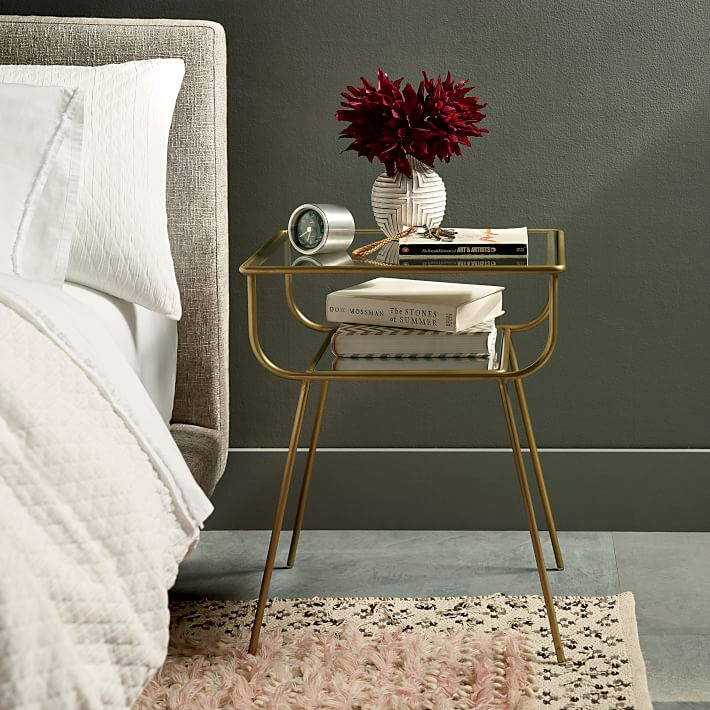 The perfect small space nightstand! Love how open and airy it is with the brass and glass combo!