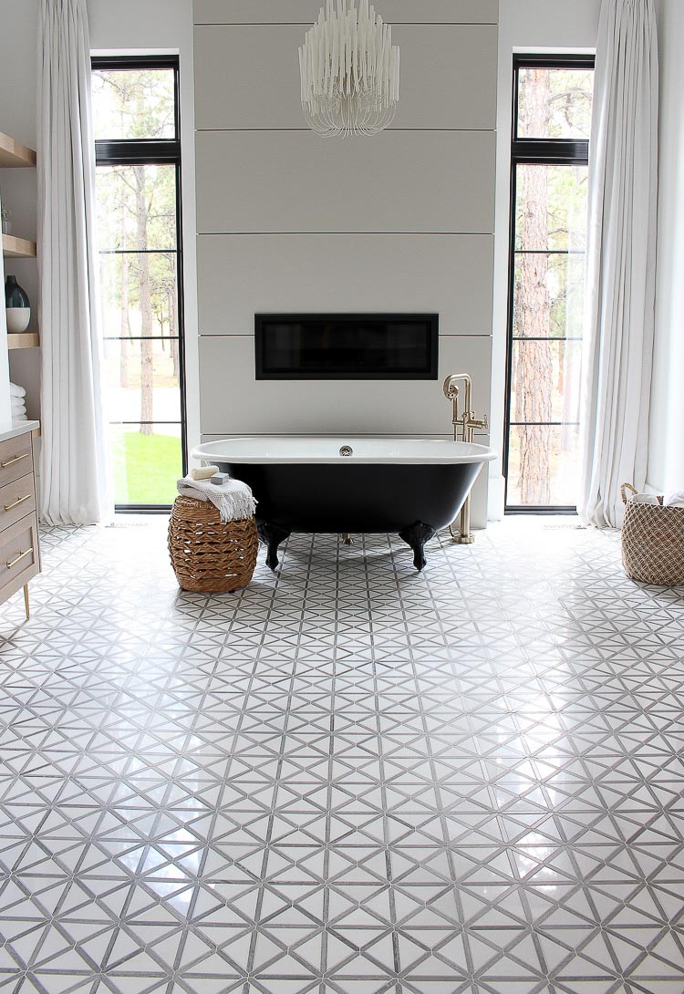 These tall windows flanking the fireplace in this master bathroom are amazing!