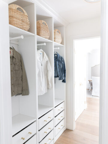 LOVE how she used IKEA Pax wardrobes to create this coat closet with drawers for shoe storage!