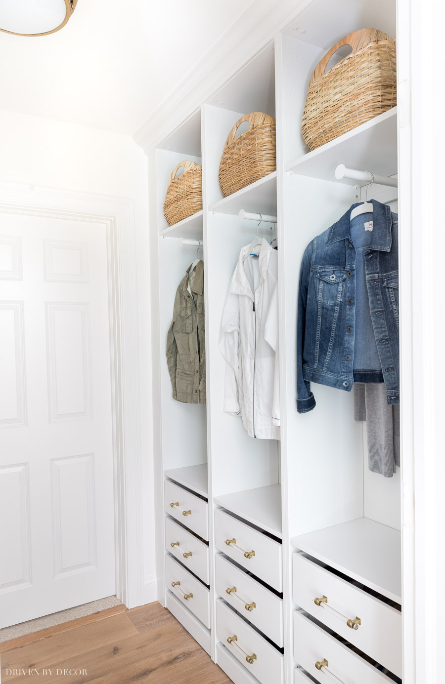 LOVE how she used IKEA Pax wardrobes to create this coat closet with drawers for shoe storage!