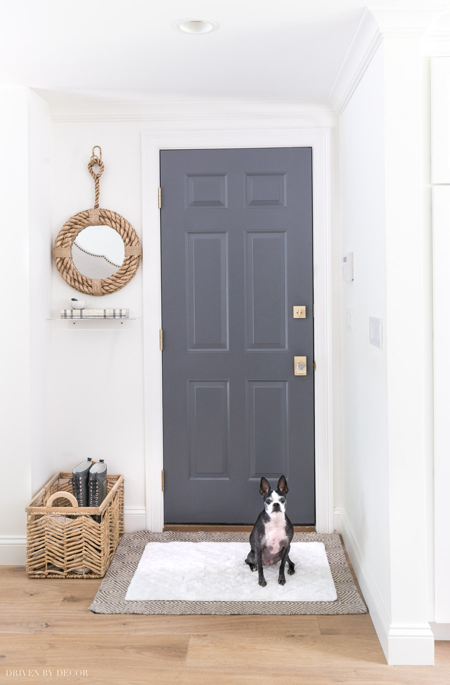 An easy to wash bathmat layered over a larger rug is a practical, stylish idea to keep dogs and kids from tracking dirt and mud into your home!