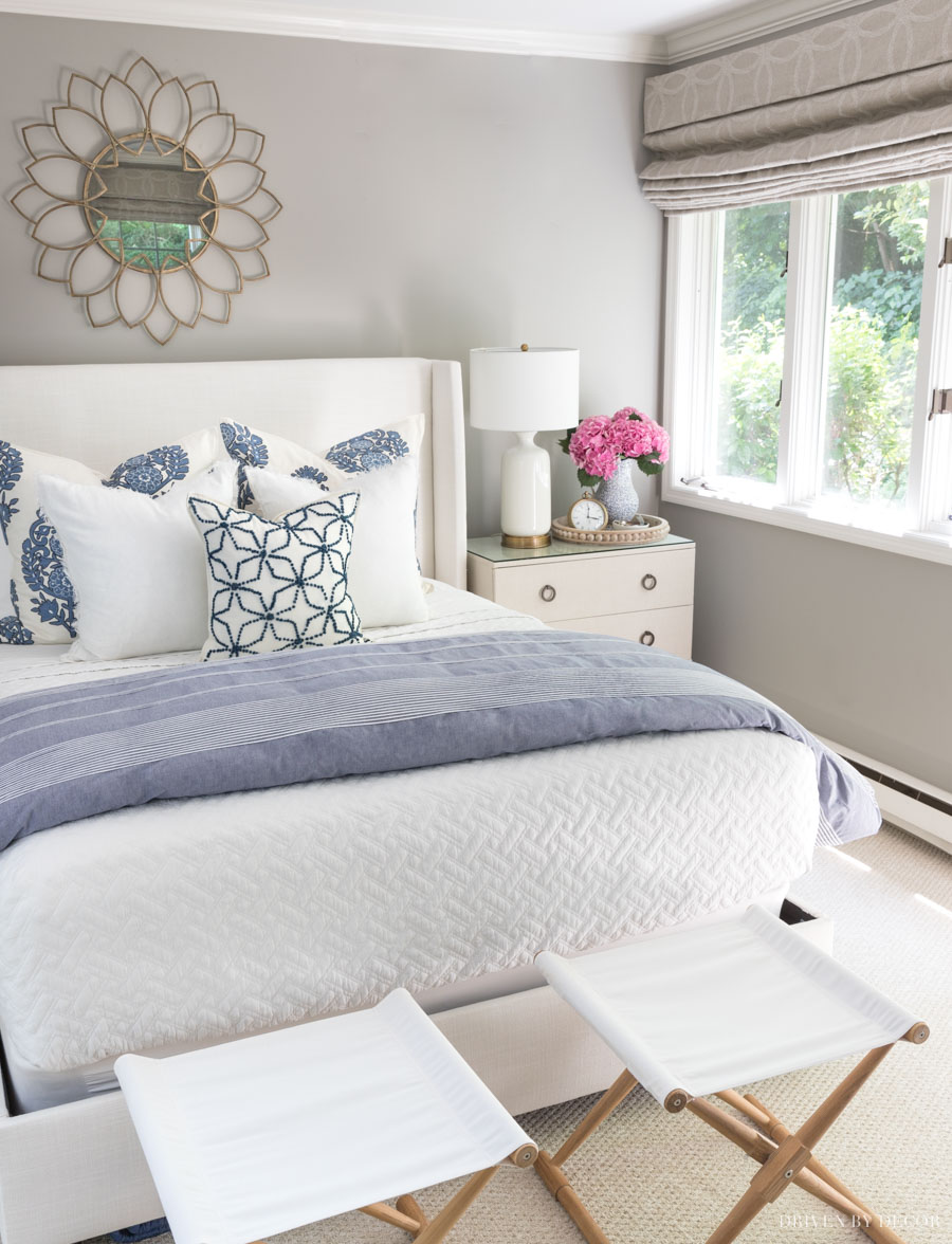 Layering blankets online on a bed