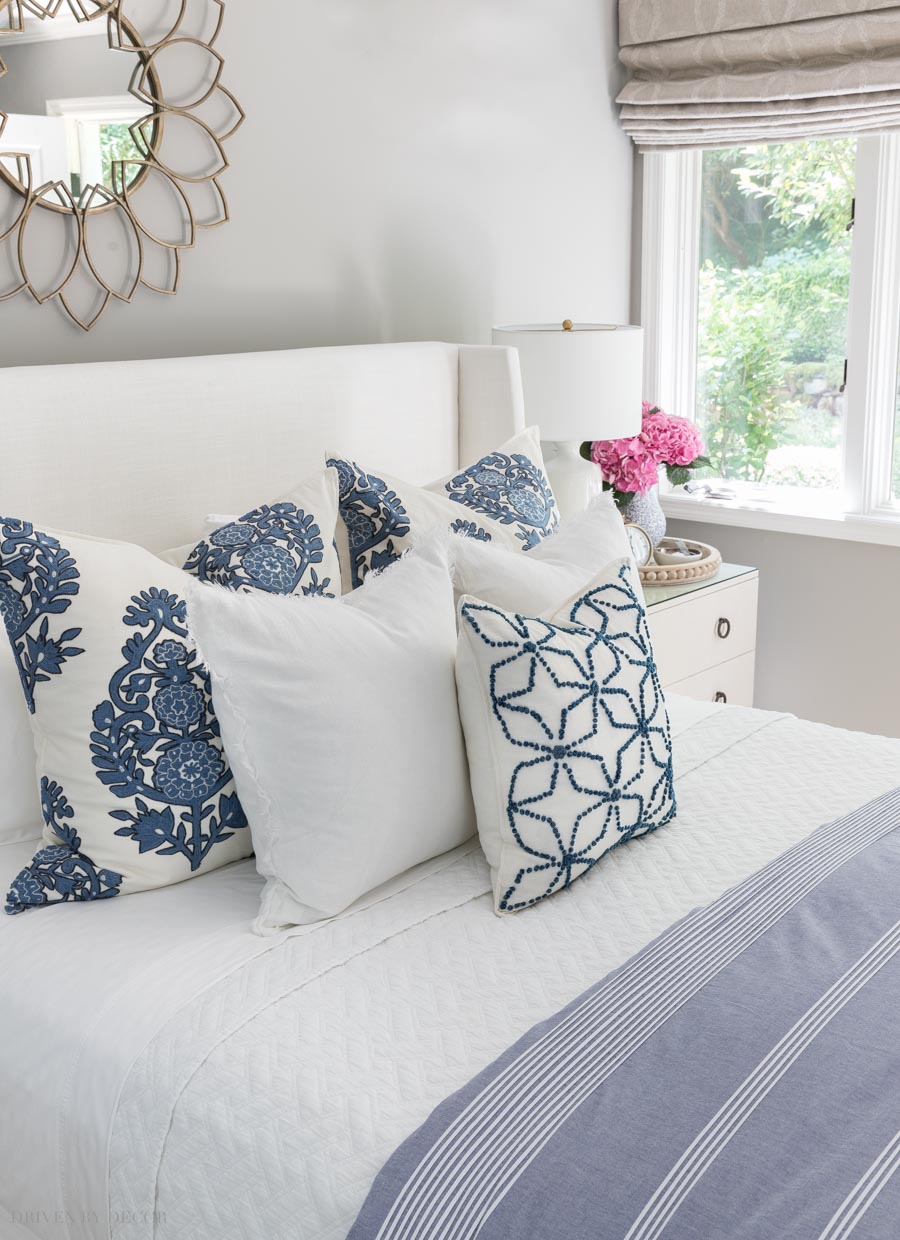 Decorative pillows on a queen bed