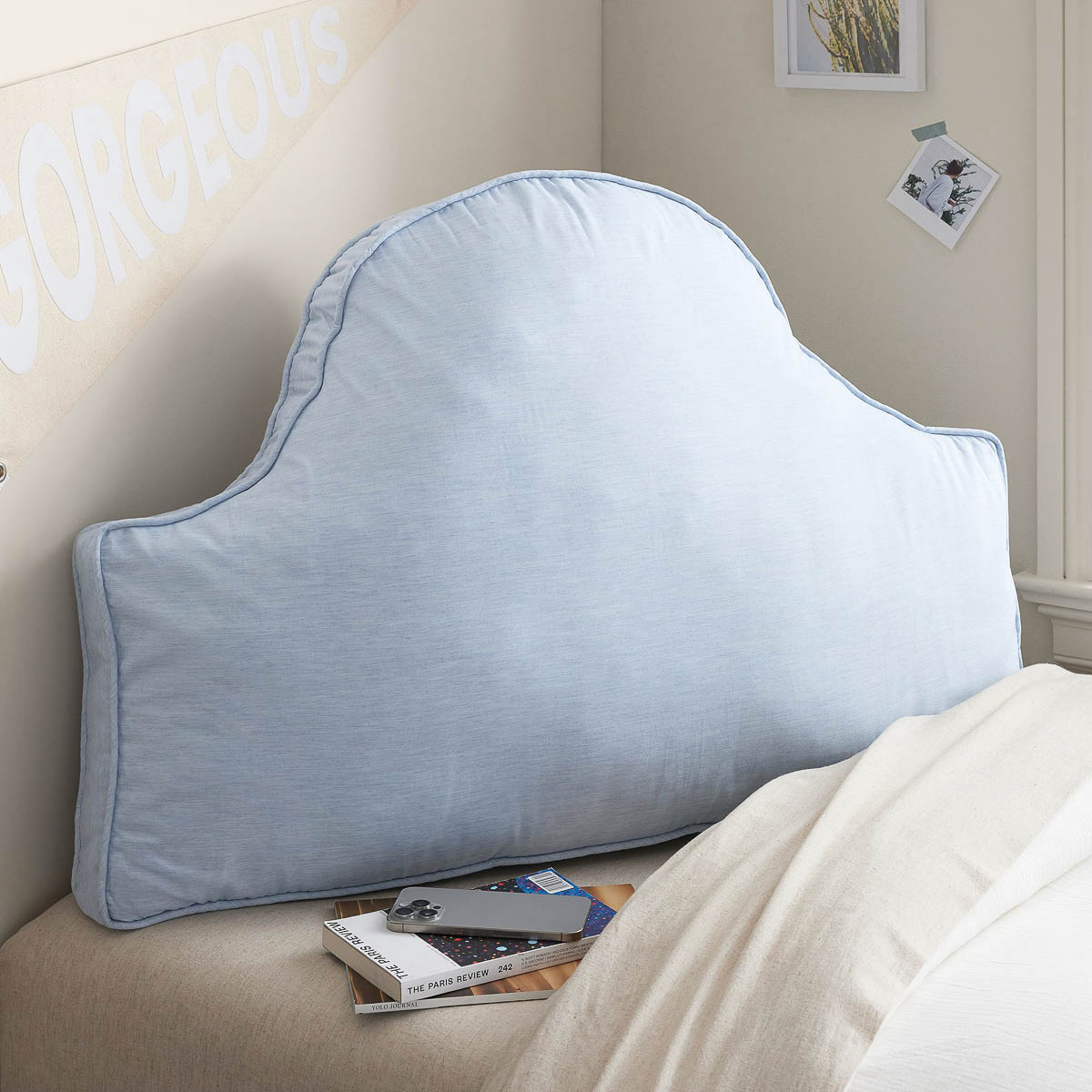 Headboard pillow on dorm room bed