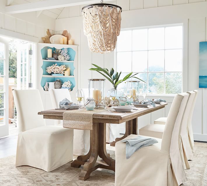Draped wood bead chandelier over a dining table