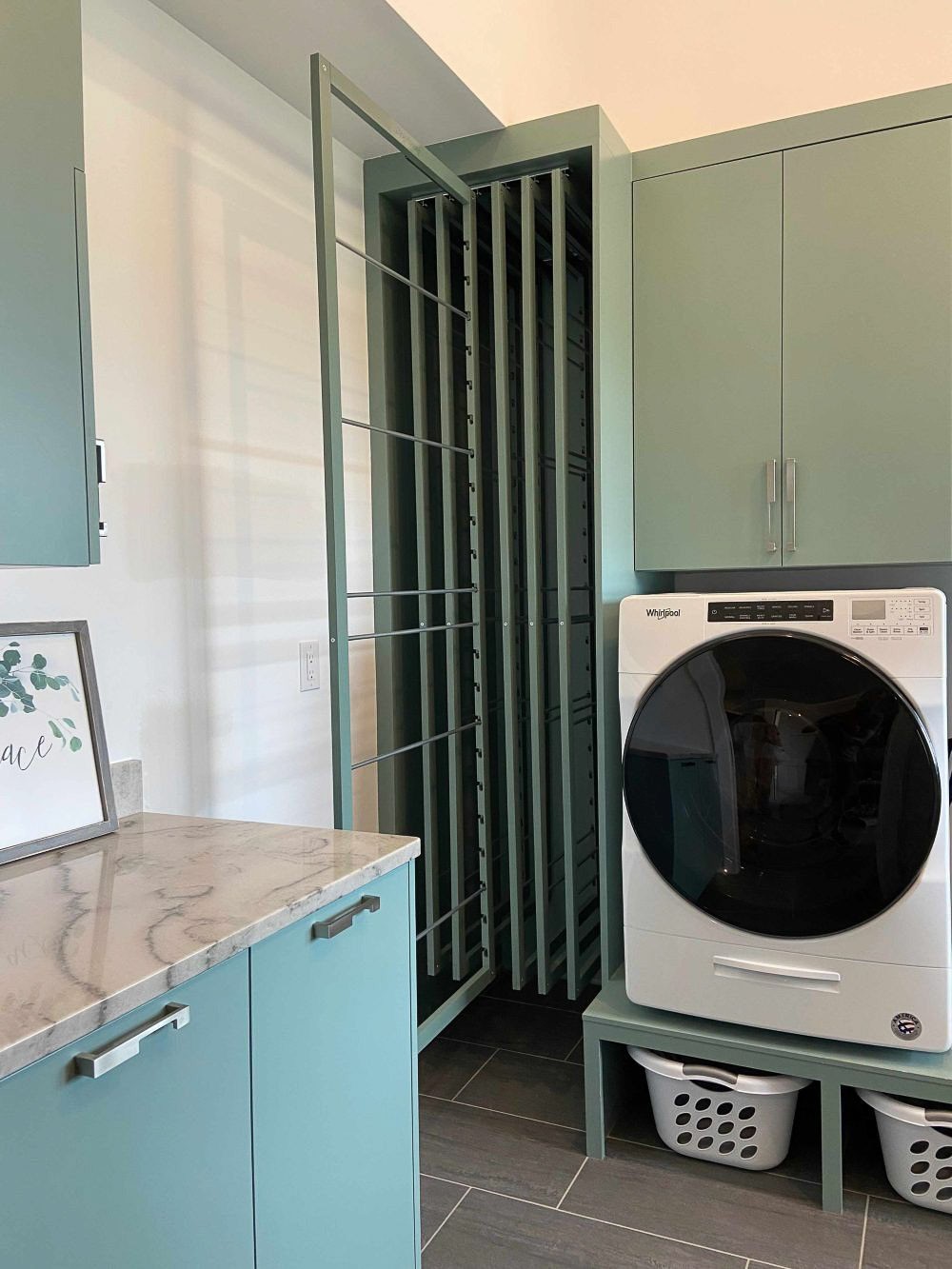 Dryaway built-in laundry drying racks in a laundry room