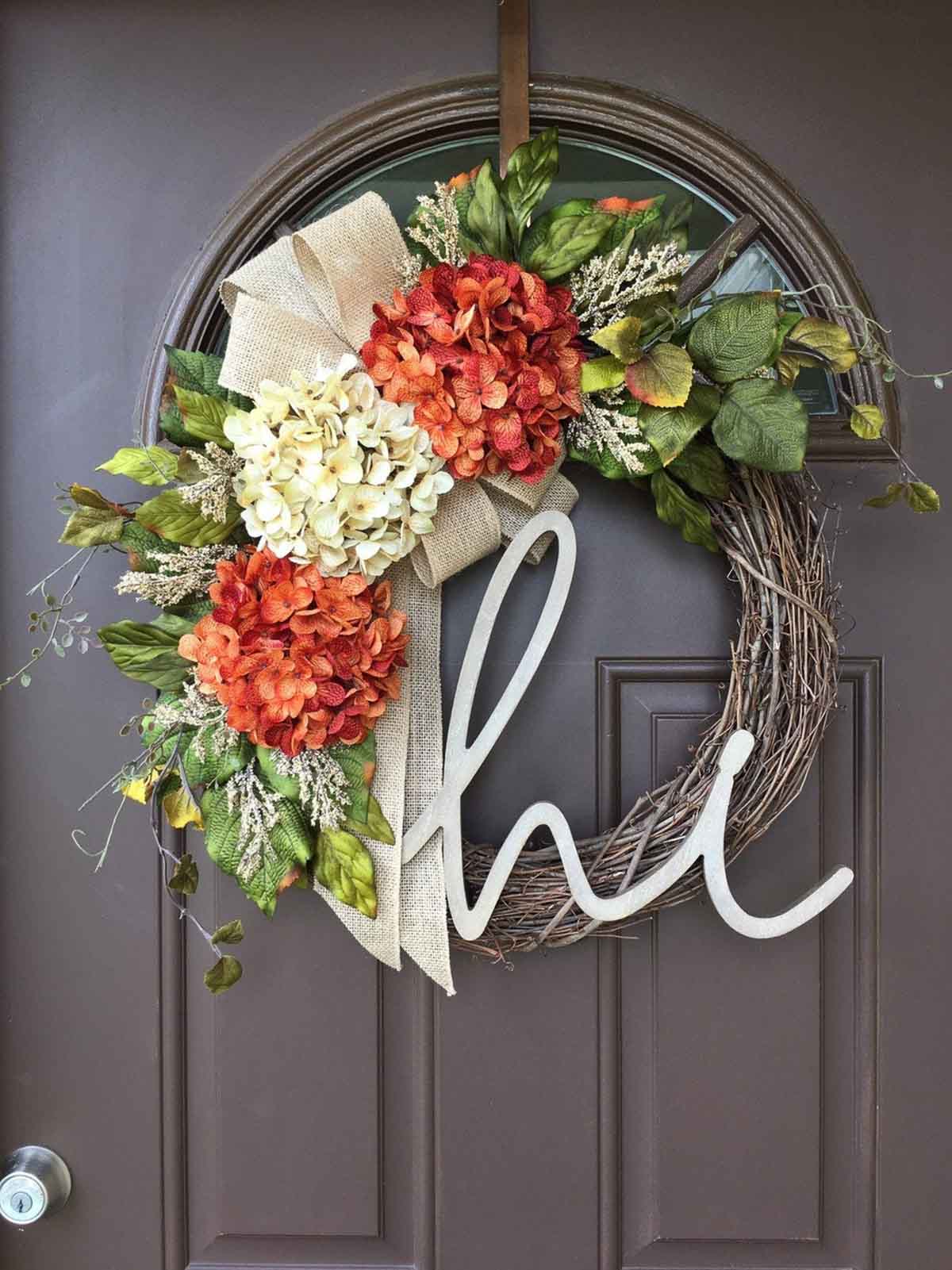 Fall wreath with faux hydrangeas and cursive hi