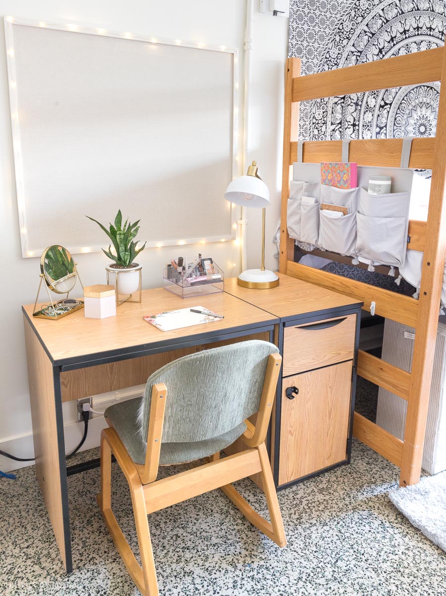 This footboard organizer that velcros on to the foot of her dorm bed is so smart for storage!