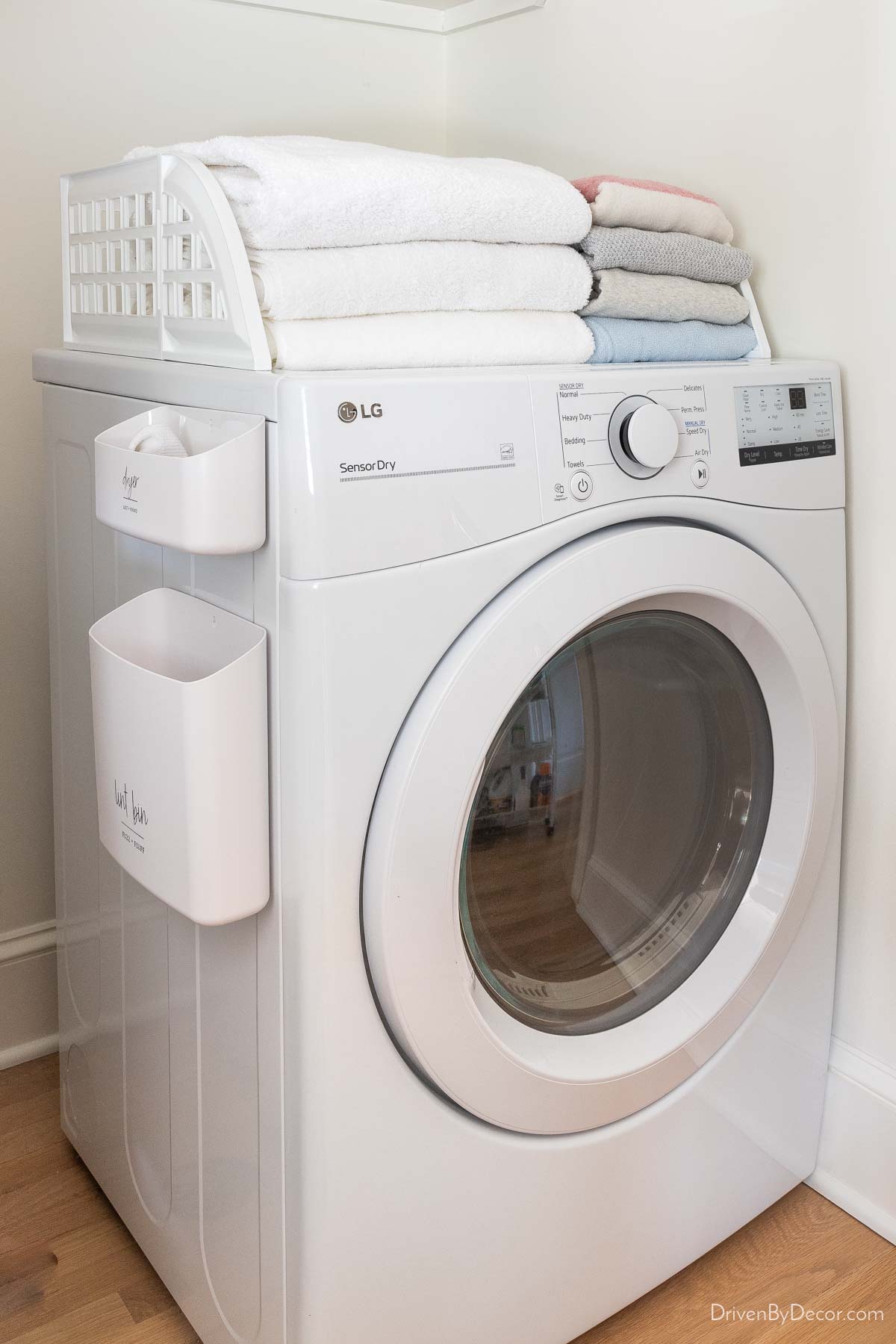 Magnetic fence on top of the dryer to corral laundry