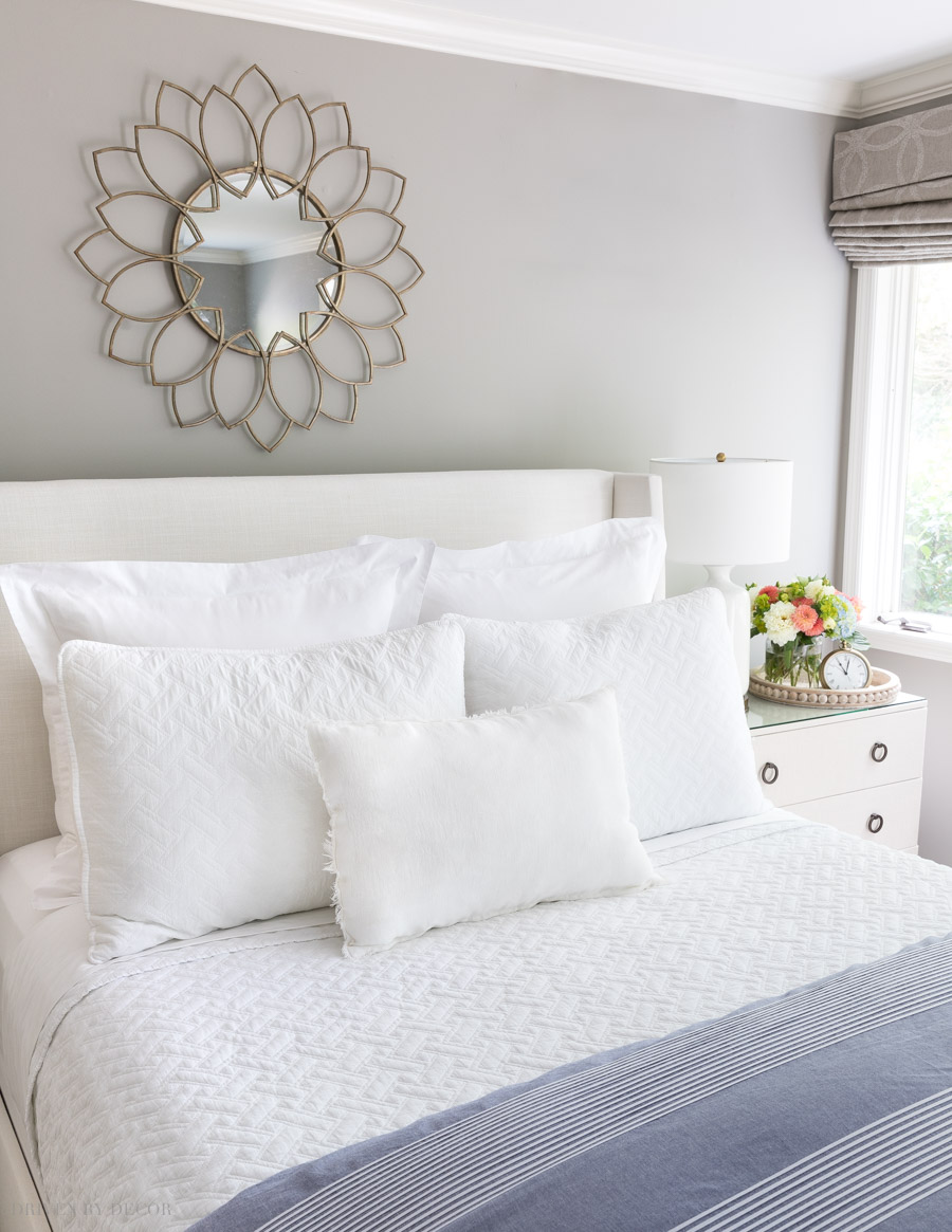 Love this all white look! This post has tons of ideas for arranging your bed pillows in different ways!