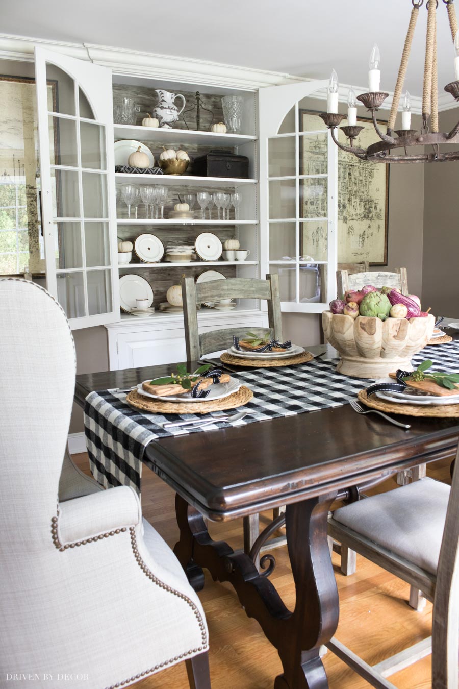 Sprinkling white baby boo pumpkins on shelving and in bowls is a super simple way to decorate for fall!