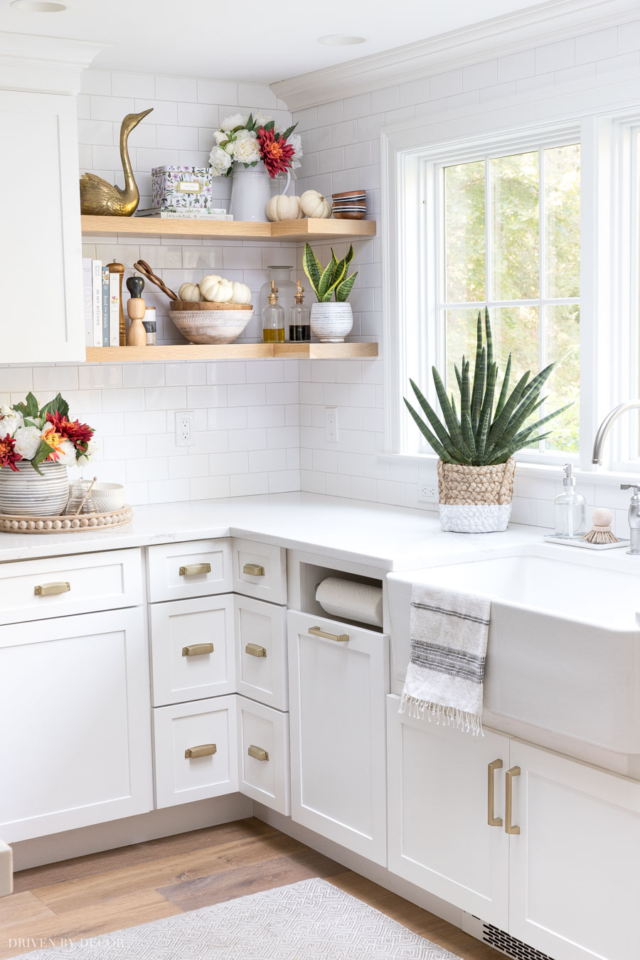 Loving the fall florals and baby boo pumpkins added to dress up this kitchen for fall!