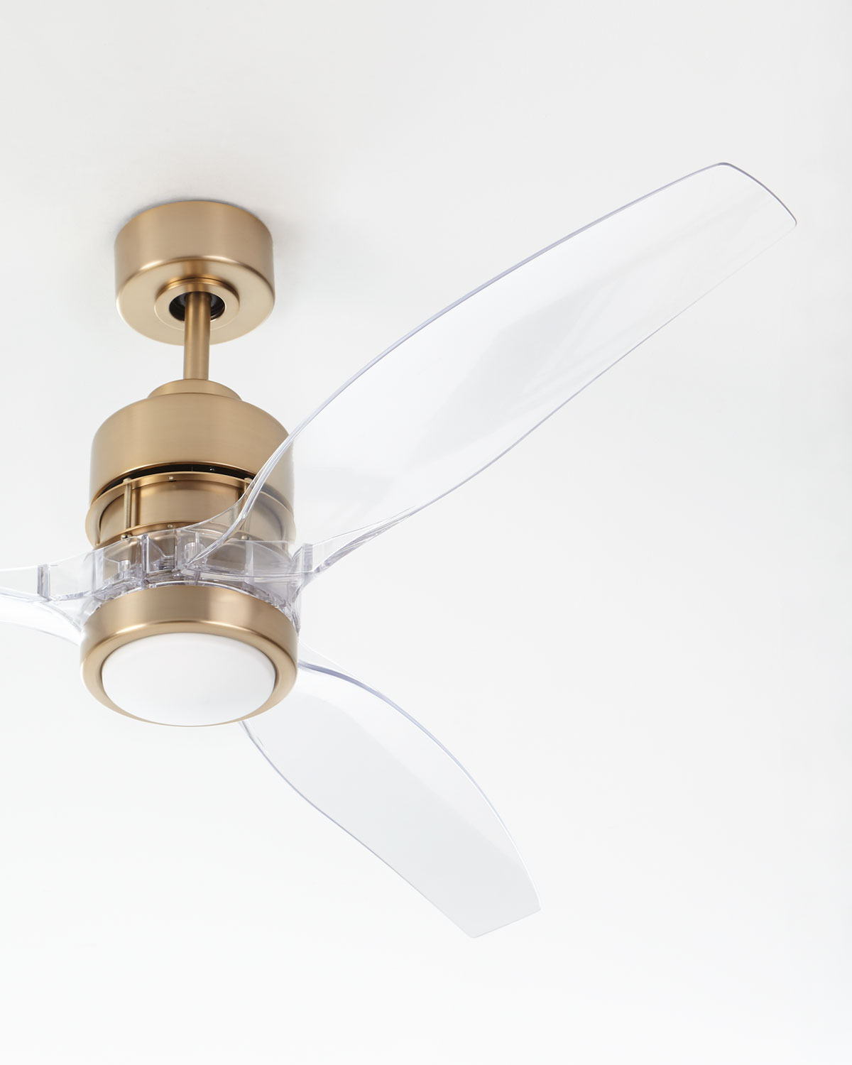 Such a pretty ceiling fan with a satin brass base and acrylic fan blades!