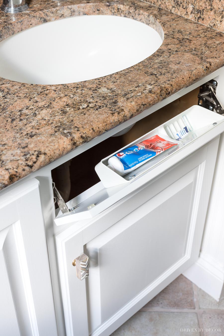 Love this little caddy for a toothbrush and toothpaste in this bathroom vanity!