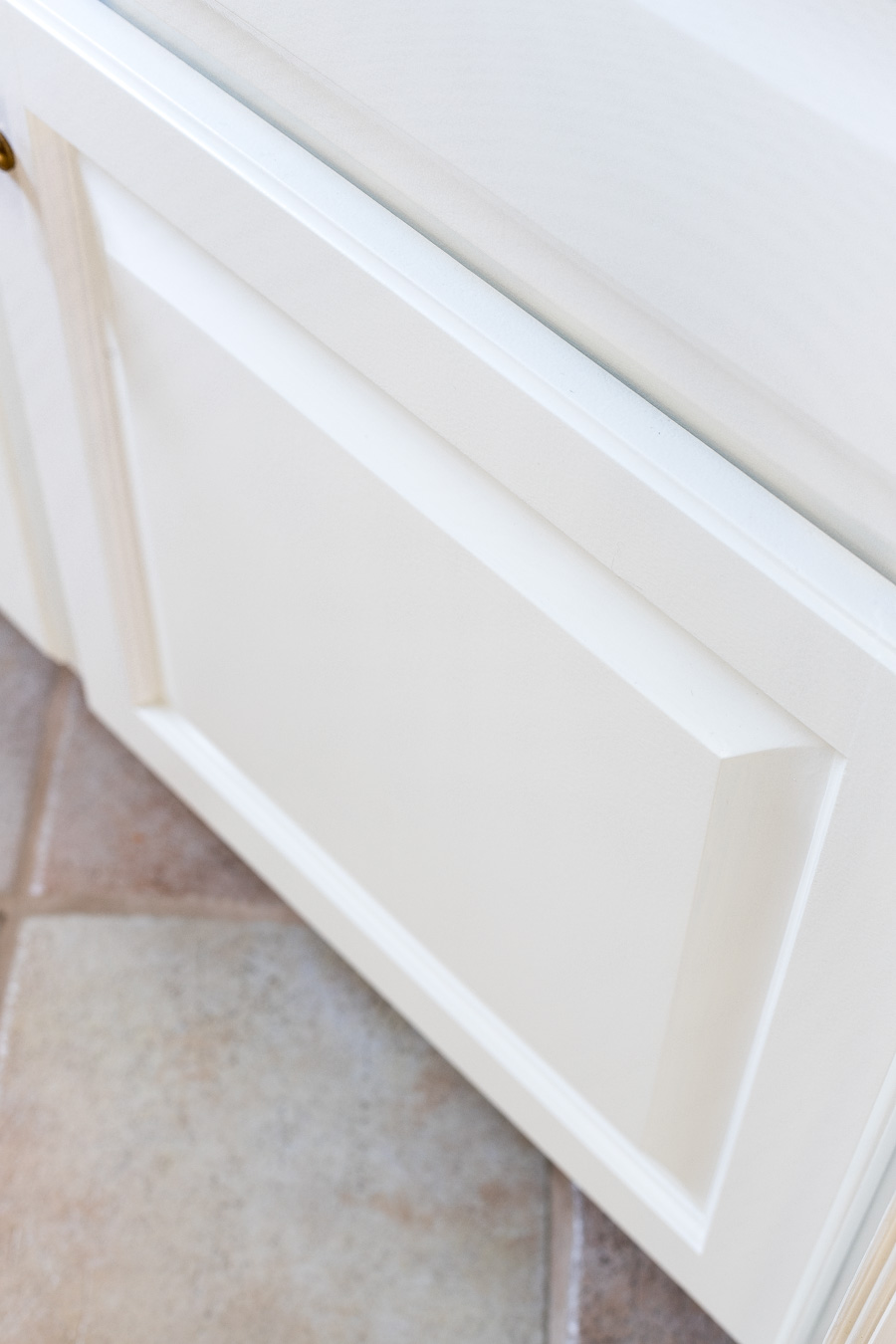 You can get a super smooth finish on painted cabinet doors if you prep and paint the right way!