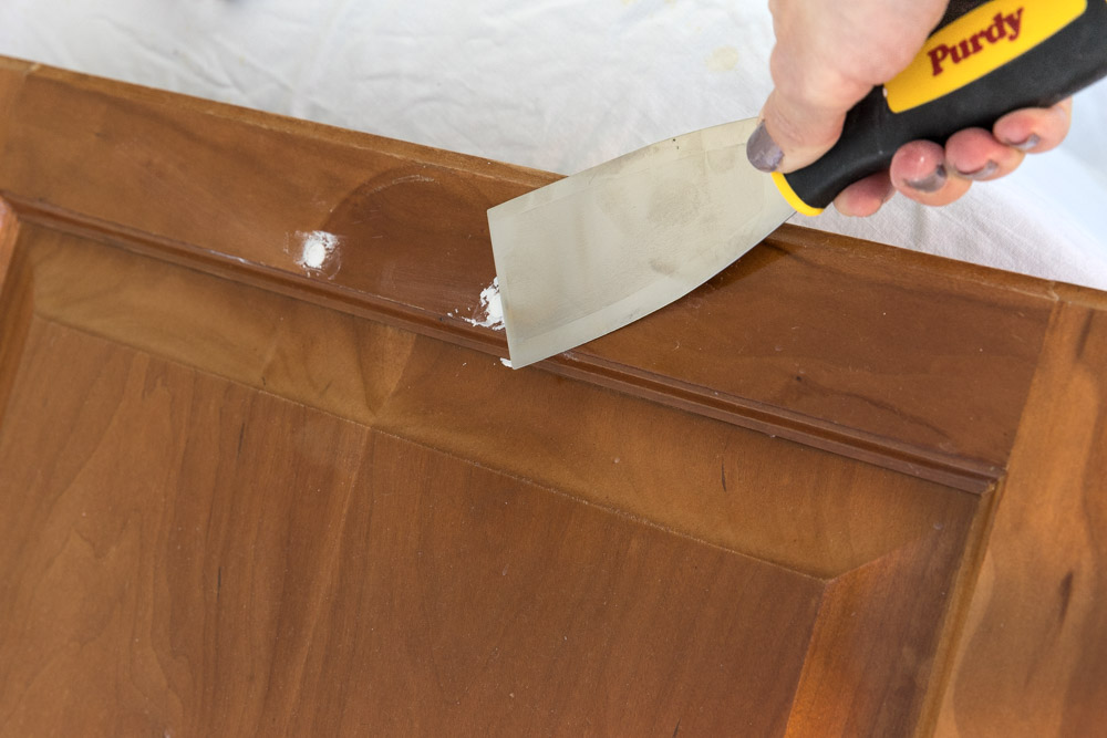 Before painting your bathroom vanity, fill any holes from hardware that won't be put back in the same place.