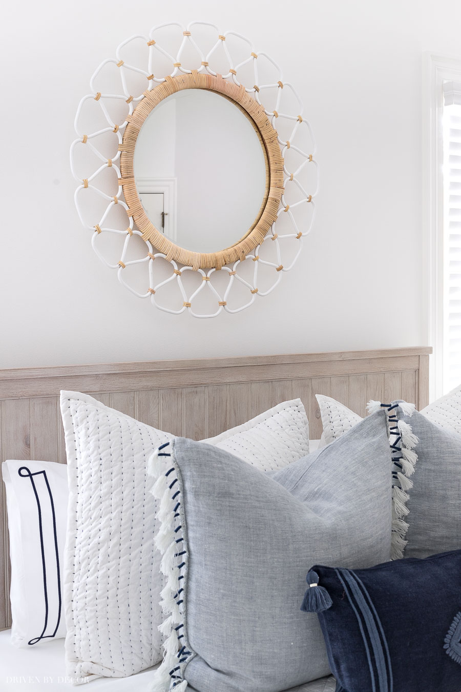 The perfect mirror for above a bed! Love the two-toned rattan!