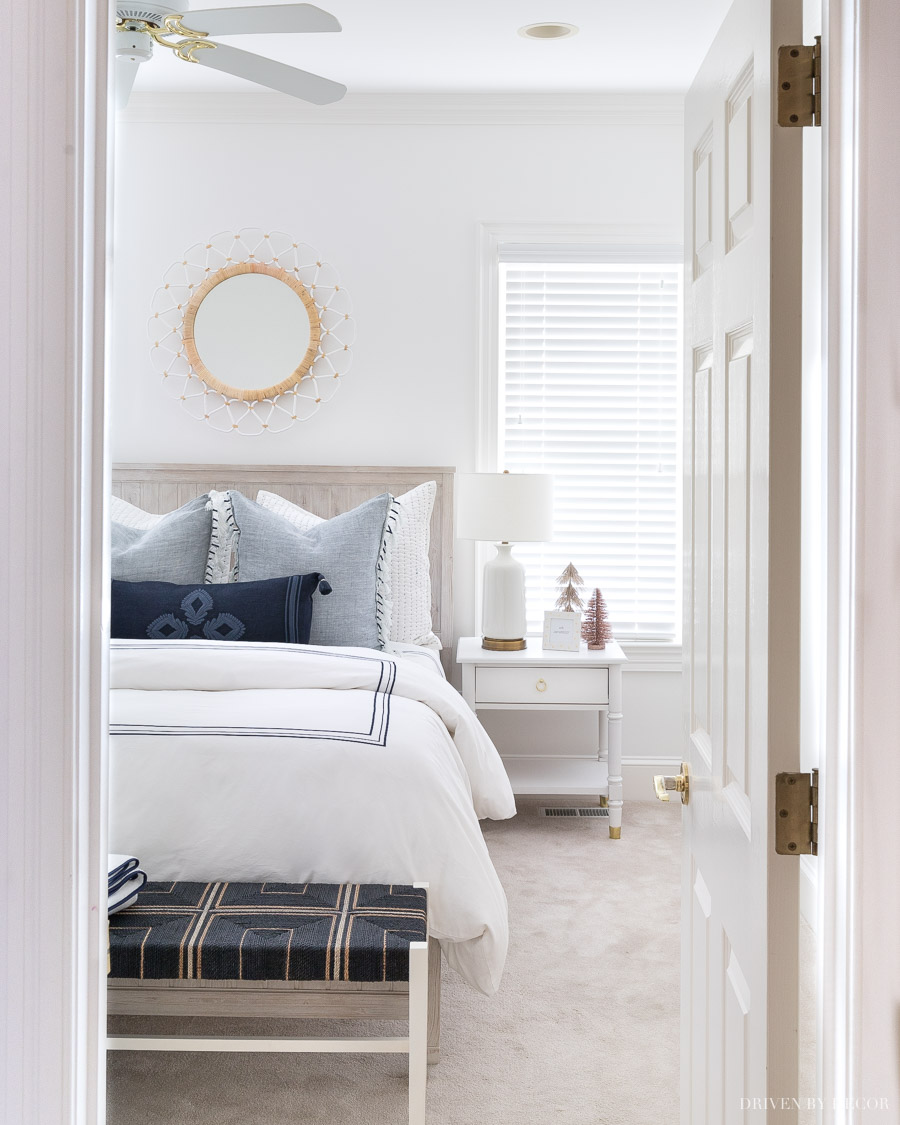 Love the round mirror over this bed!