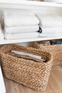 These tall, shallow console baskets work perfectly for storing our grocery and shopping bags!