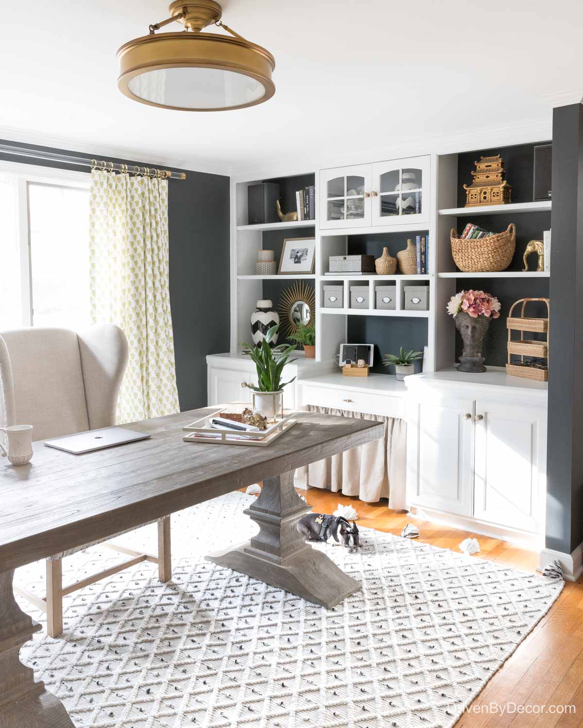 The brass flushmount ceiling light above the desk in our home office - a favorite Amazon home decor find!