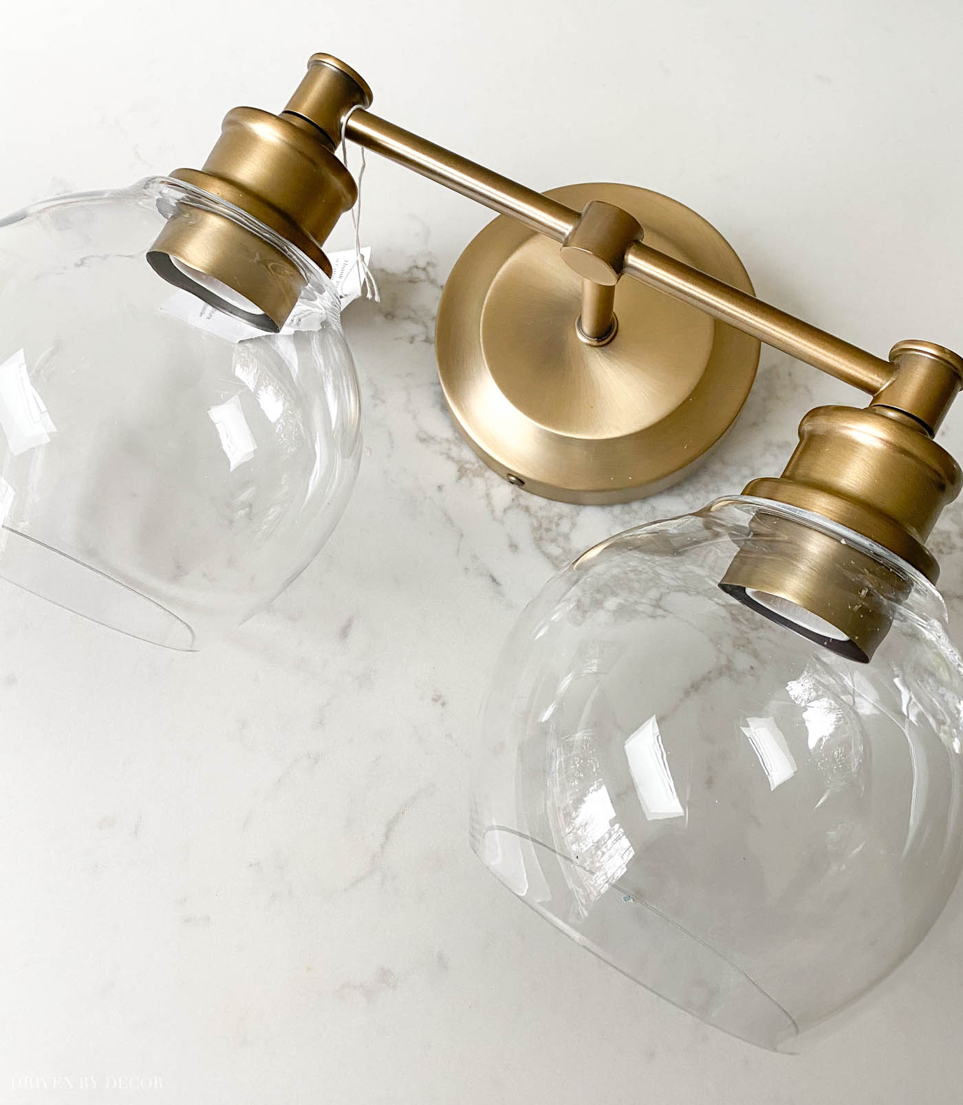 Love these two-light brass globe lights for over a bathroom vanity mirror!