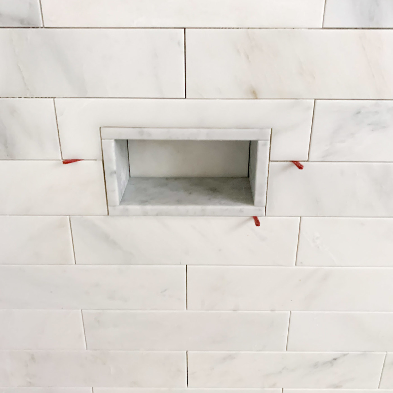 Love the idea of a foot rest niche like this for shaving in the shower!